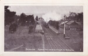 578 postcard. express train dashing through to melbourne